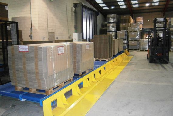 Pallets of completed board awaiting a fork lift on a Stedi-Stak