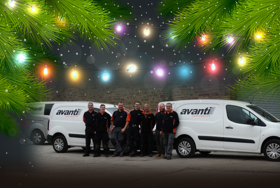Avanti workers in front of avanti branded vans, with christmas tree branches and lights